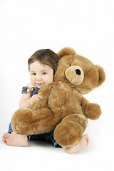 Image showing Baby Girl hugging her teddy