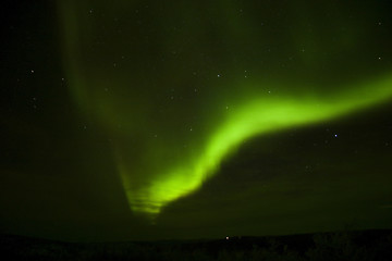 Image showing Bright aurora arc and a cloud