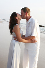 Image showing Couple kissing on the beach.