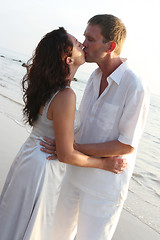 Image showing Couple kissing on the beach.