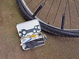 Image showing Mending a puncture on a mountain bike.