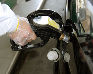 Image showing Pouring petrol