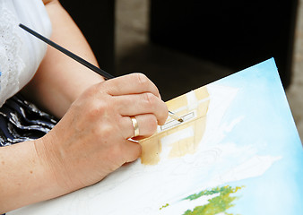 Image showing Artist painting hand