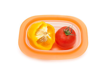 Image showing Cut wanted pepper and red tomato