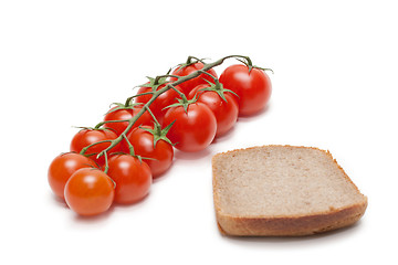 Image showing Red tomatoes cherry, pumpernickel two