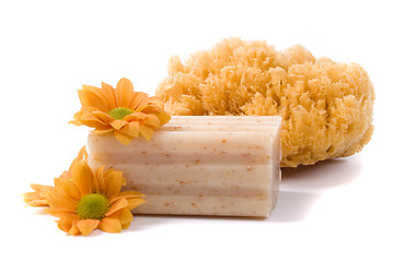 Image showing natural sponge, soap and flowers