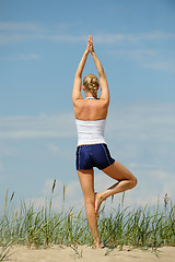 Image showing Female workout on the beach