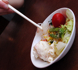 Image showing Salad and chopsticks