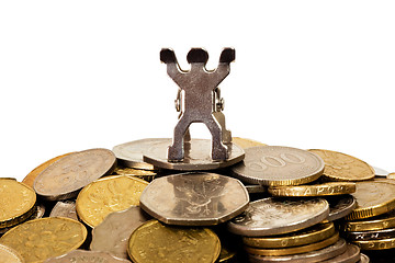 Image showing Figurine on top of a pile of coins