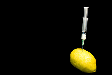 Image showing syringe on a lemon