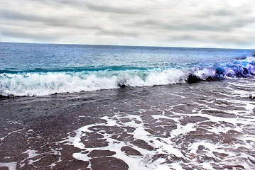 Image showing Sea wave and cloudy sky