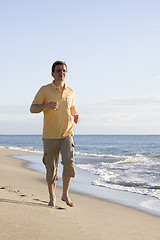 Image showing Man running on the beach