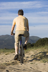 Image showing Man riding bicycle