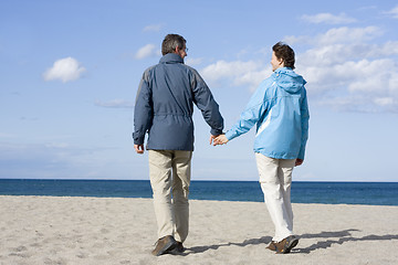 Image showing Mid-adult couple on the beach