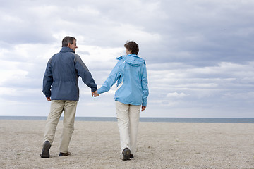 Image showing Mid-adult couple on the beach