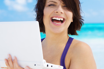 Image showing woman with laptop computer on the beach