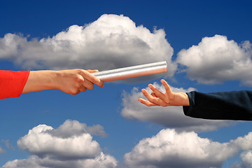Image showing hands passing the baton