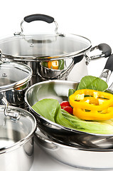 Image showing Stainless steel pots and pans with vegetables