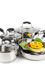 Image showing Stainless steel pots and pans with vegetables