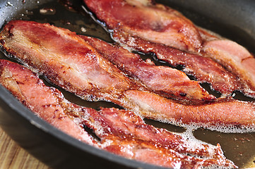 Image showing Bacon frying in a pan