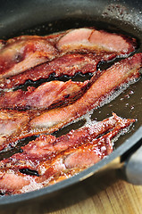 Image showing Bacon frying in a pan