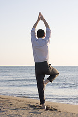 Image showing Businessman doing yoga