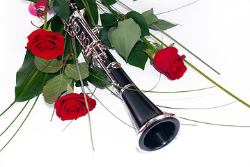 Image showing Red roses and clarinet