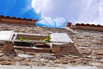 Image showing Blue curtain on wind