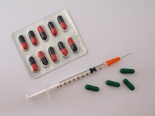 Image showing Hypodermic syringe and drugs.