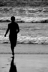 Image showing SILHOUETTE RUNNING AT THE BEACH