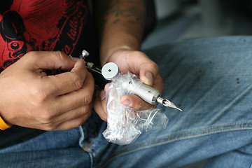 Image showing Tattoo artist.