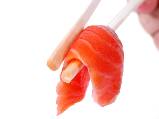 Image showing Salmon meat in chopsticks