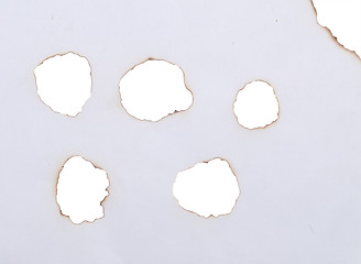 Image showing burnt holes