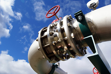 Image showing Pipes, bolts, valves against blue sky 