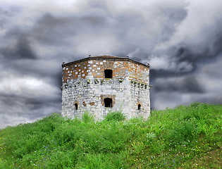 Image showing Old stone tower over cloudy sky