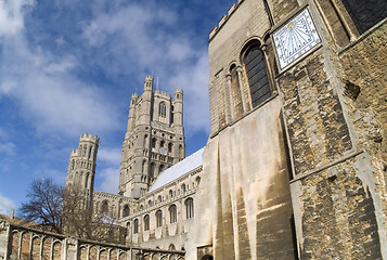 Image showing Very wide angle view of west tower of Ely Cathedral, Cambridgeshire, England from the south east, also showing the sundial