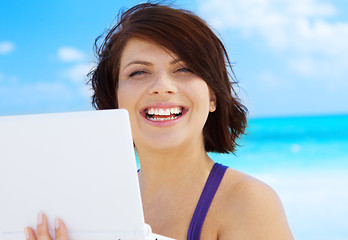 Image showing woman with laptop computer on the beach