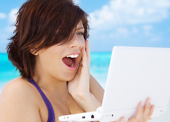 Image showing woman with laptop computer on the beach