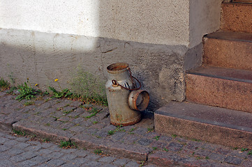 Image showing Milk can on door step.