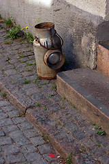 Image showing Milk can at doorstep