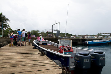 Image showing editorial tourists board panga commuter boat corn island nicarag