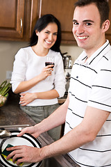 Image showing Young couple in the kitchen