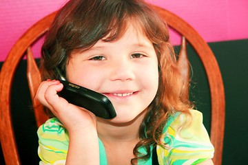 Image showing Young girl talking on telephone