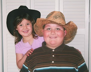 Image showing Brother and sister with cowboy hats