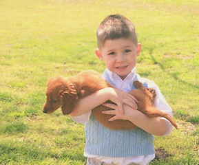 Image showing Little boy with his dog