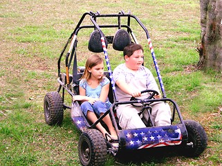 Image showing Young boy and girl on go cart