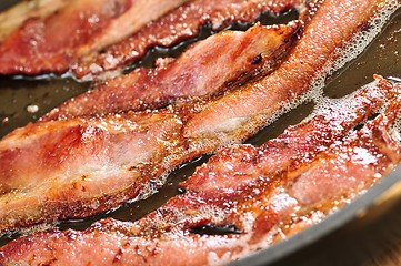 Image showing Bacon frying in a pan