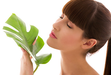 Image showing woman with green leaf