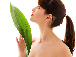 Image showing woman with green leaf