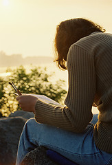 Image showing Female painter in sunrise